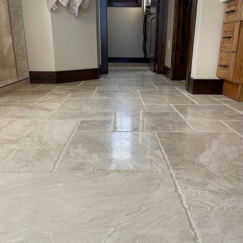Textured natural stone tiles in a UT bathroom