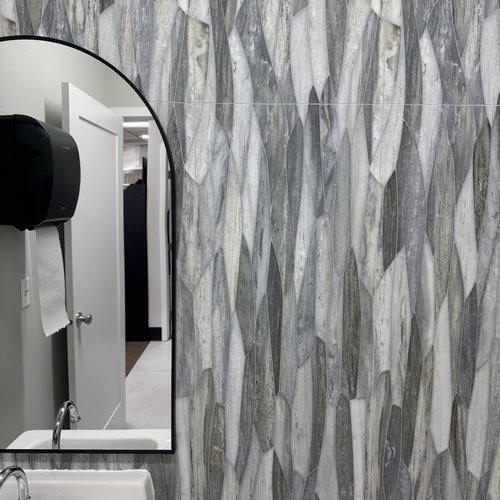 Trendy Tile backsplash wall in a modern bathroom