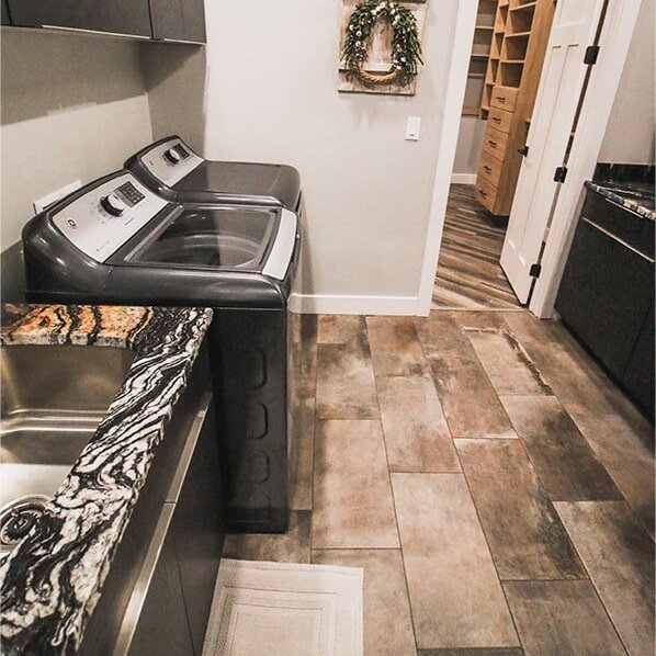 Laundry room design at 'Elements at Sunset' from Pioneer Floor Coverings & Design