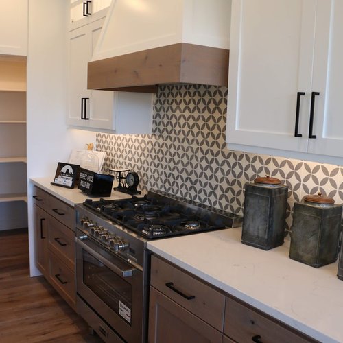 Stylish kitchen with patterned tile backsplash